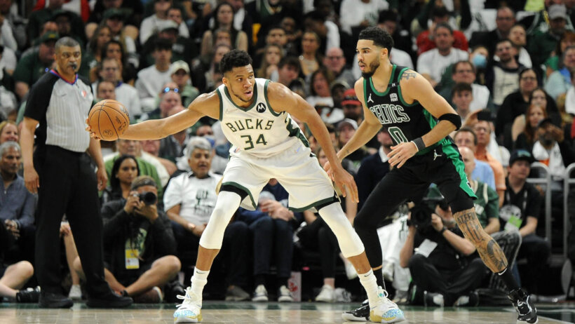 Giannis Antetokounmpo guarded by Jayson Tatum