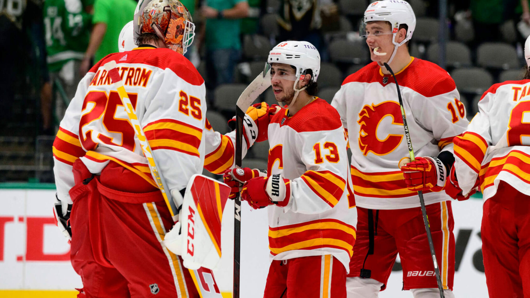 Calgary Flames players celebrating a win over Dallas