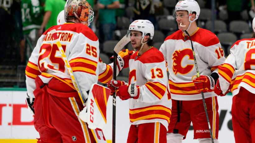 Calgary Flames players celebrating a win over Dallas