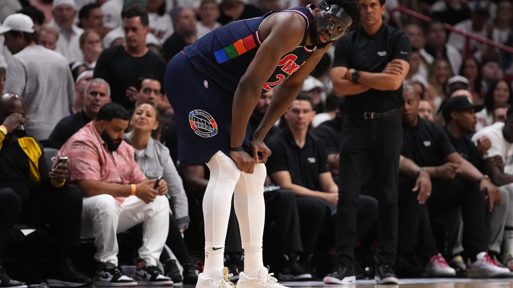Joel Embiid bent over