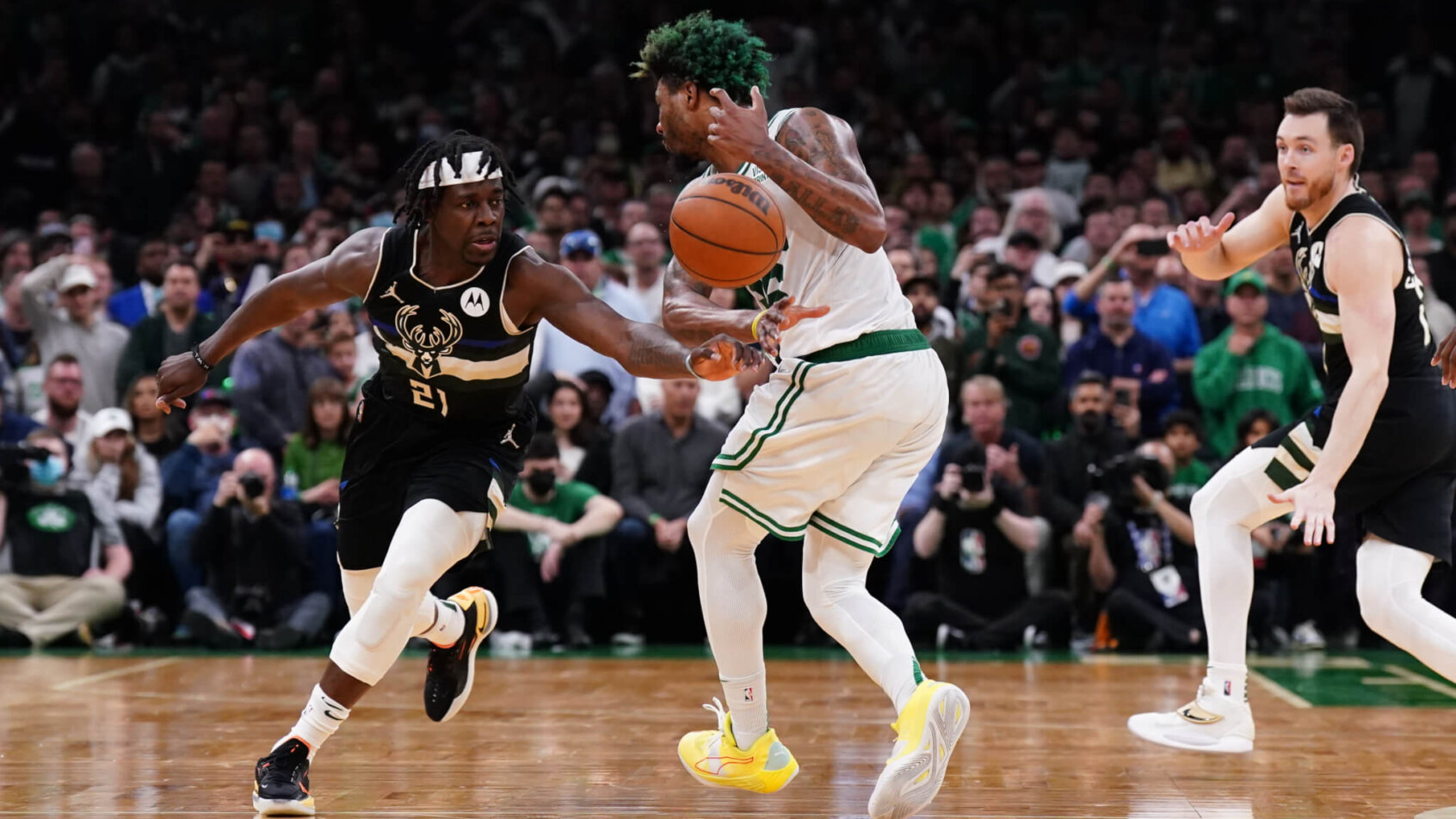 Jrue Holiday steals the ball from Marcus Smart
