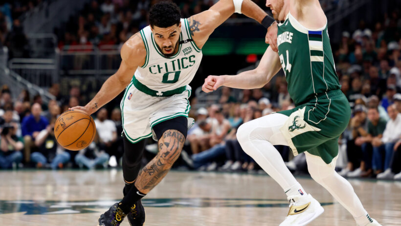 Jayson Tatum driving past defender