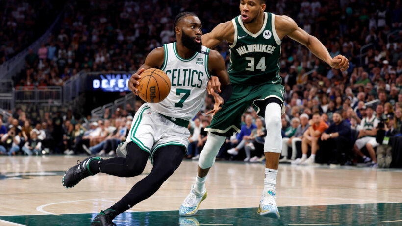 Jaylen Brown drives to basket against Giannis Antetokounmpo