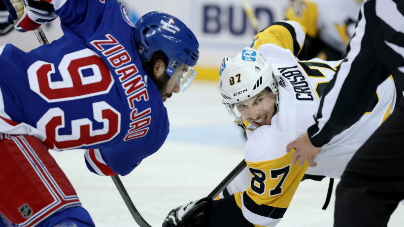Pittsburgh Penguins center Sidney Crosby takes a face off against New York Rangers center Mika Zibanejad