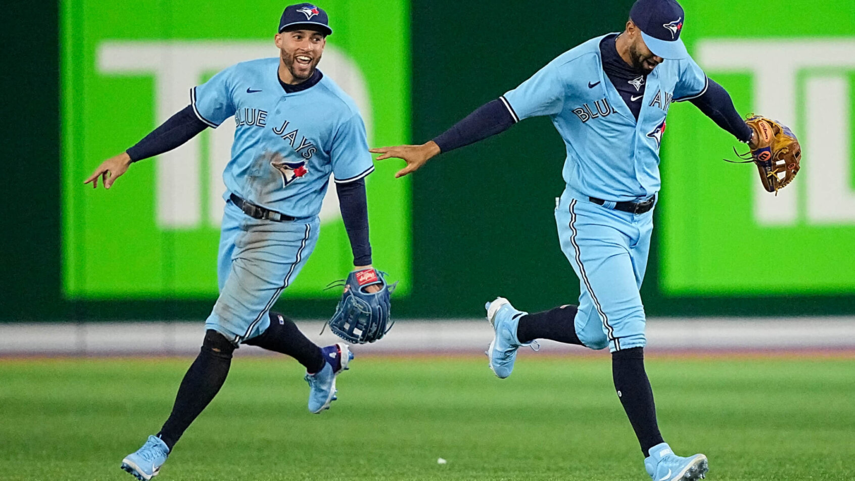 Toronto Blue Jays players running around field