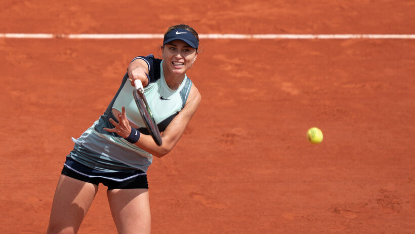 Paula Badosa hitting a shot during a tennis match.