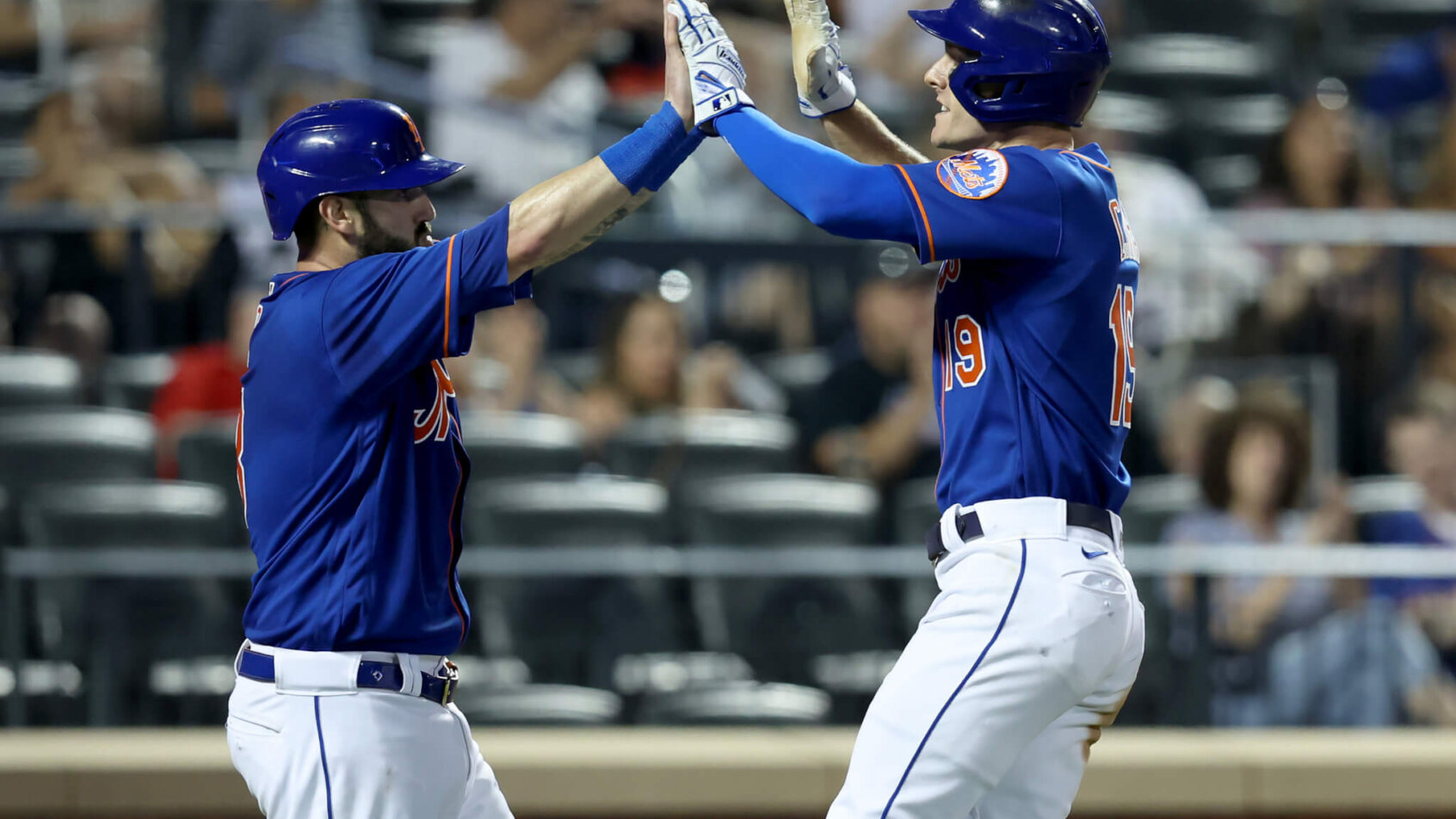 New York Mets catcher Tomas Nido celebrating with center fielder Mark Canha