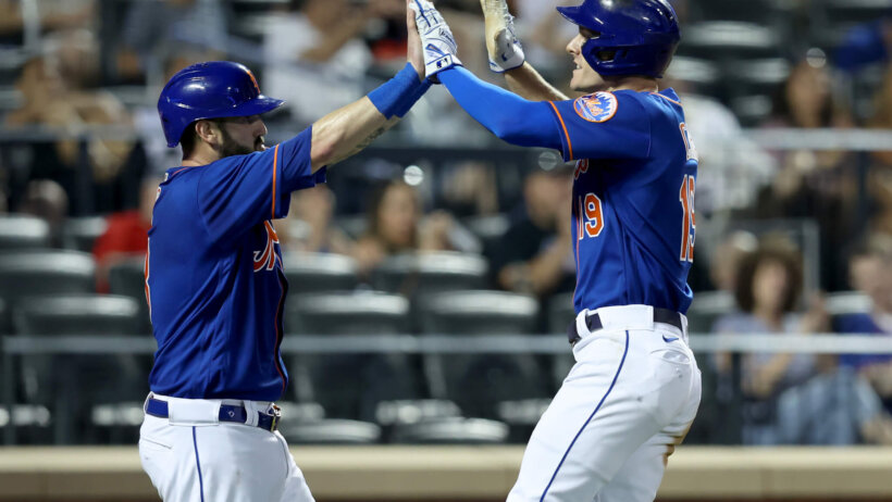 New York Mets catcher Tomas Nido celebrating with center fielder Mark Canha