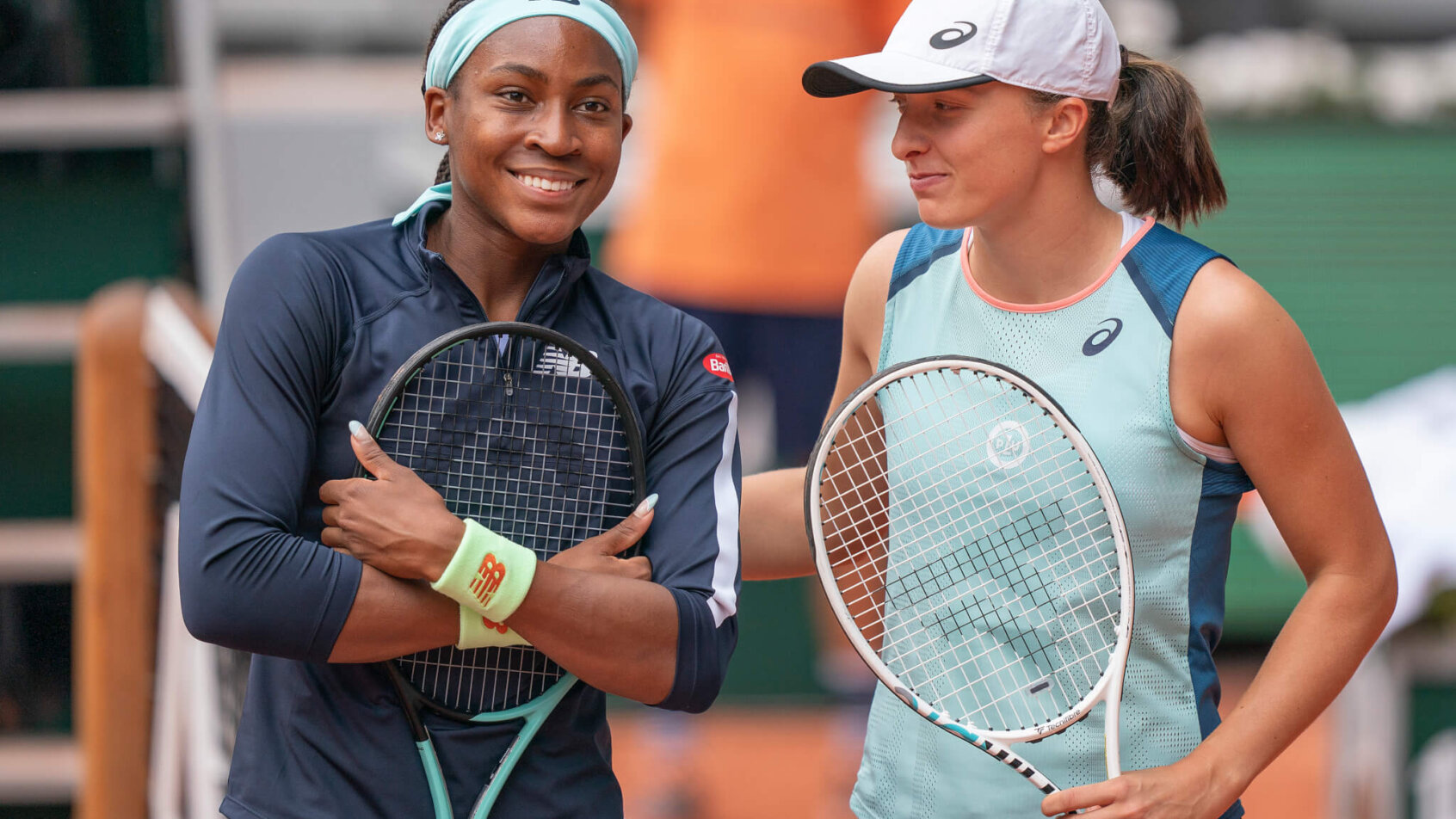 Coco Gauff and Iga Swiatek chatting after a match.