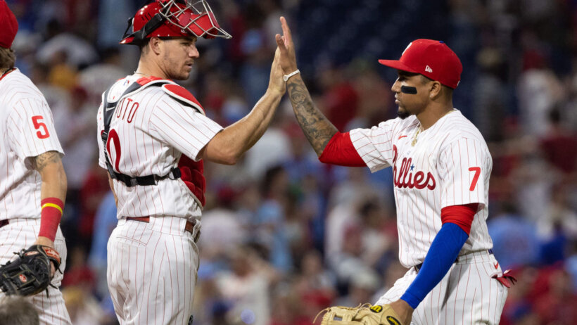 J.T. Realmuto and Johan Camargo high five