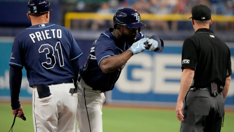 Tampa Bay Rays right fielder Randy Arozarena talking to an umpire