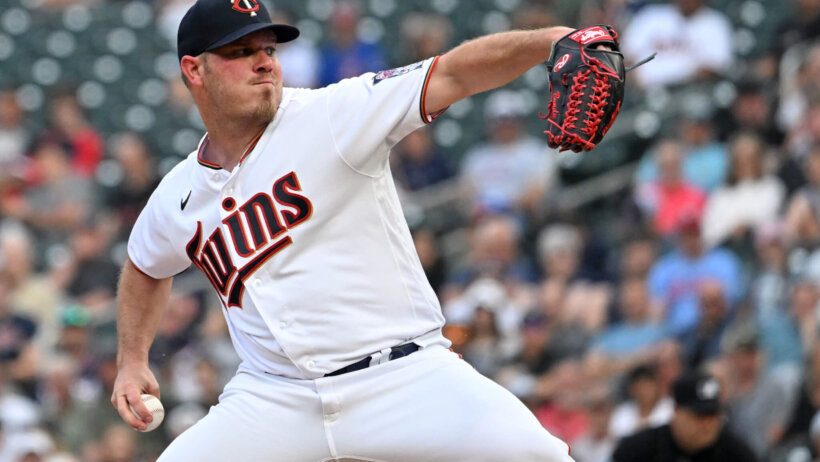 Minnesota Twins pitcher Dylan Bundy throwing a pitch during a game.