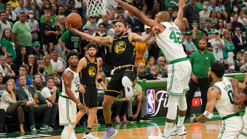 Steph Curry drives for the contested lay-up
