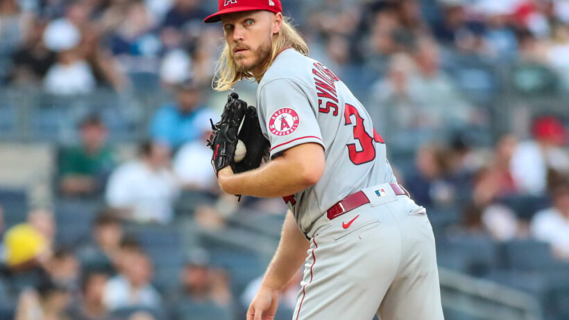 Los Angeles Angels starting pitcher Noah Syndergaard looking over to first base
