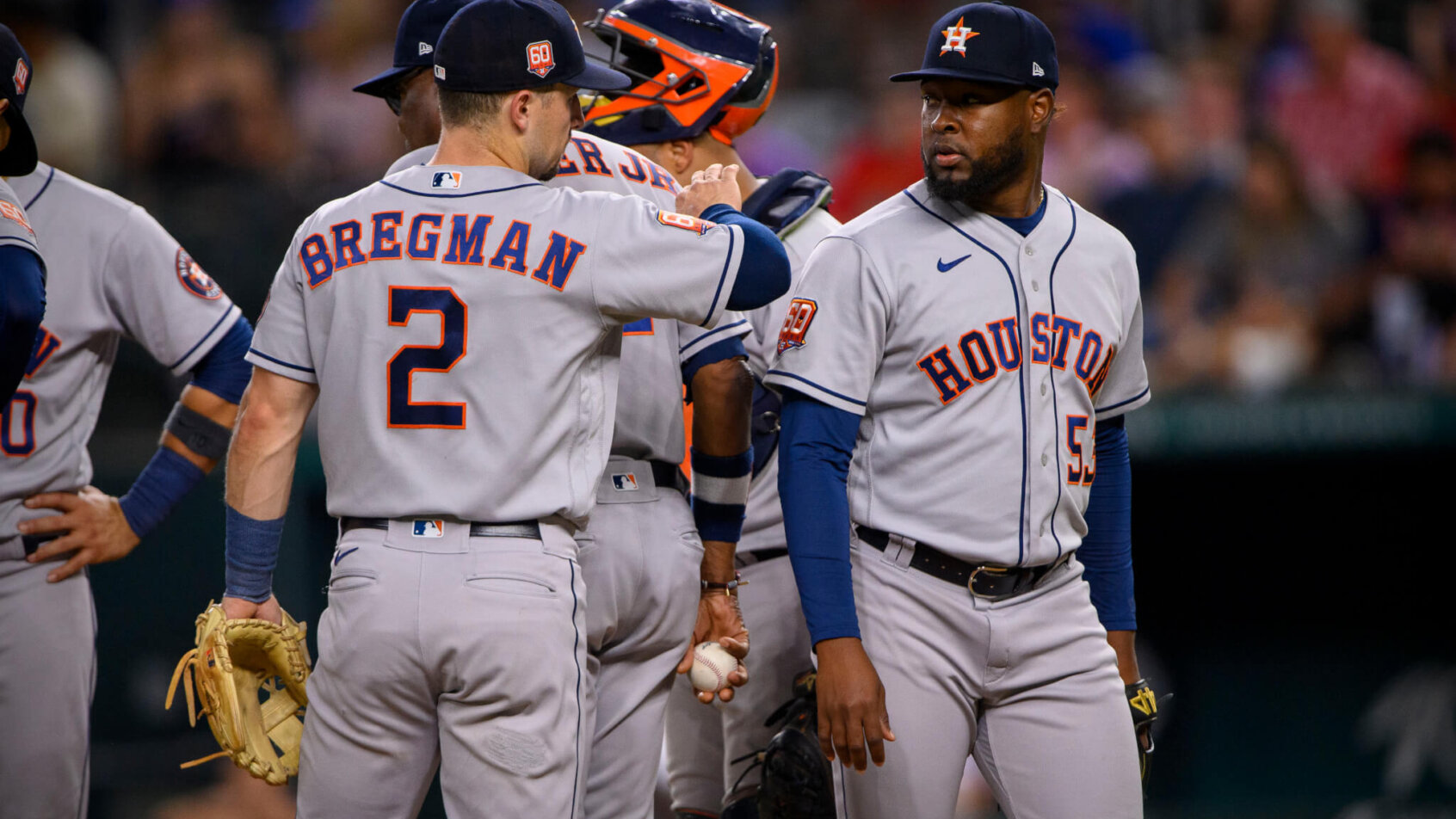Houston Astros players at the mound.