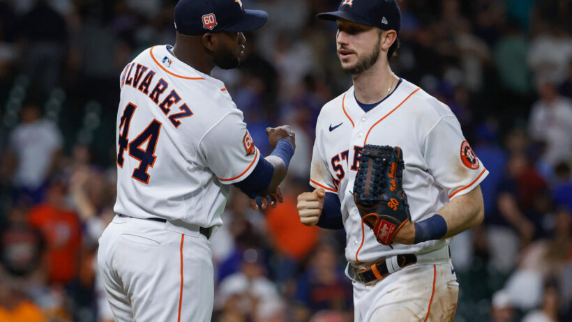 Houston Astros teammates Yordan Alvarez and Kyle Tucker celebrate a win