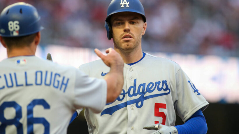 Freddie Freeman celebrates scoring a run