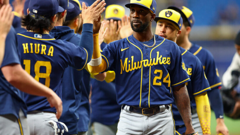 Milwaukee Brewers players congratulating each other after a win
