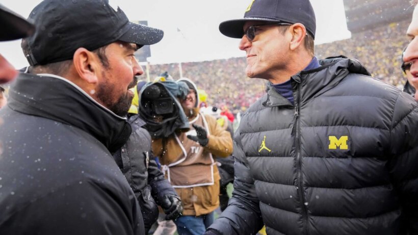 Ohio State coach Ryan Day shakes hands with Michigan coach Jim Harbaugh