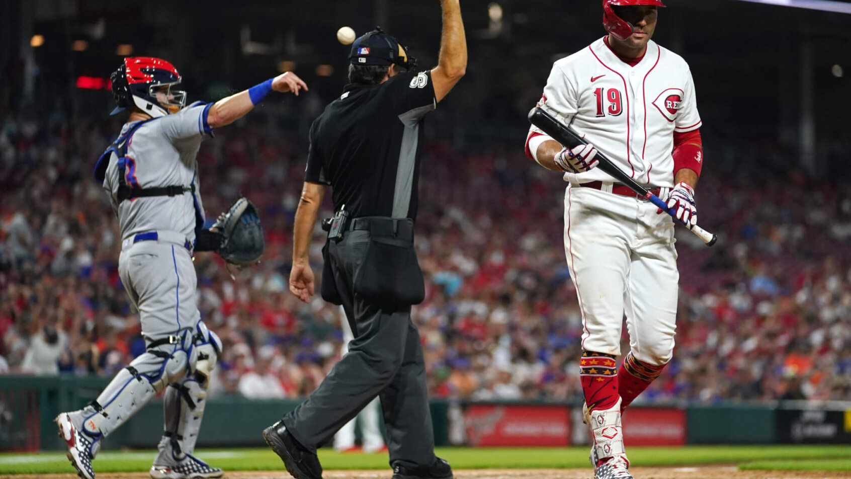 Joey Votto walking back to the Reds dugout after striking out