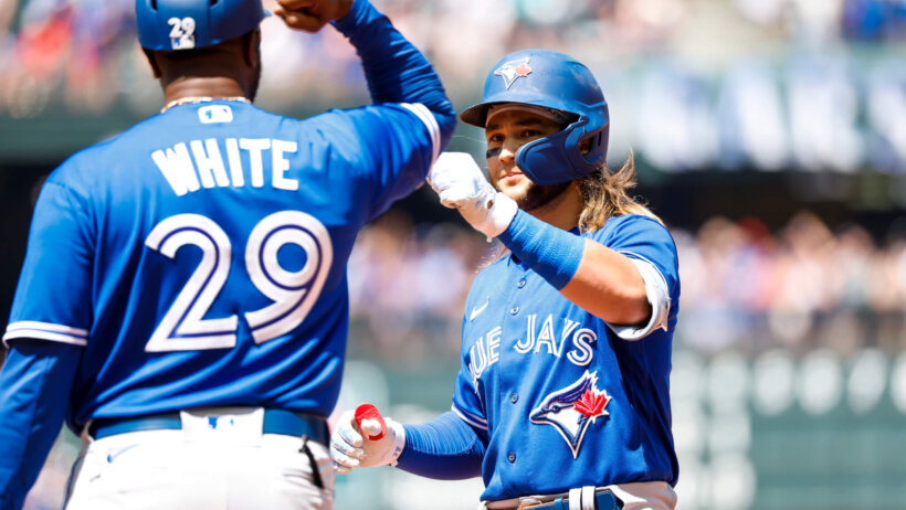 Bo Bichette high-five after a hit