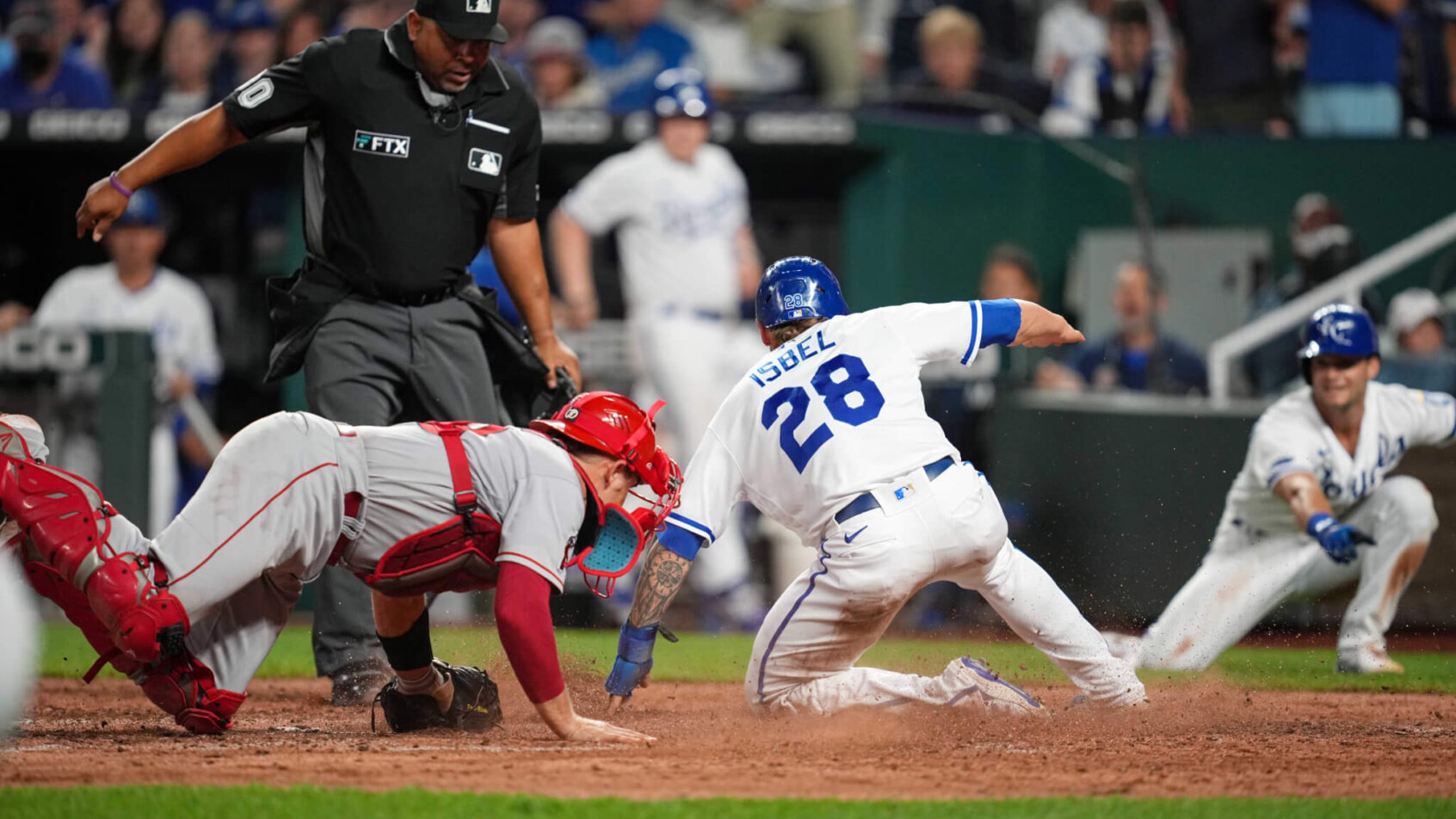Kyle Isbel slides home safely