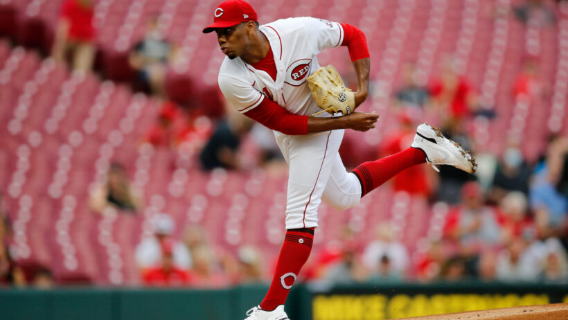 Cincinnati Reds starting pitcher Hunter Greene throwing a pitch