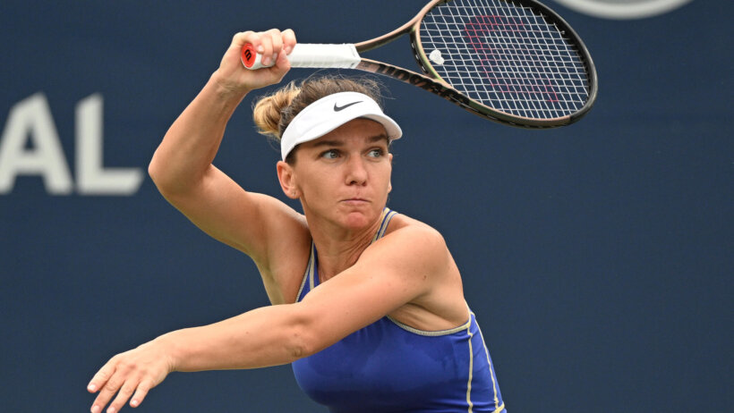 Simona Halep setting up to hit a return shot during a match.