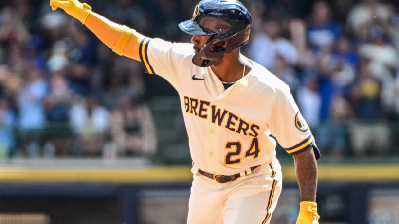 Milwaukee Brewers left fielder Andrew McCutchen celebrating a home run