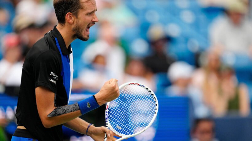 Daniil Medvedev celebrating a win during a tennis tournament.