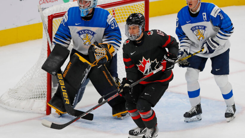 Team Canada forward Connor Bedard looks for a pass