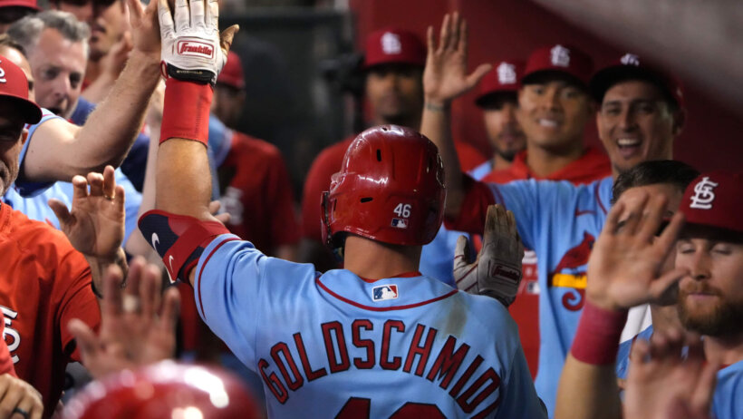 St. Louis Cardinals dugout high fives