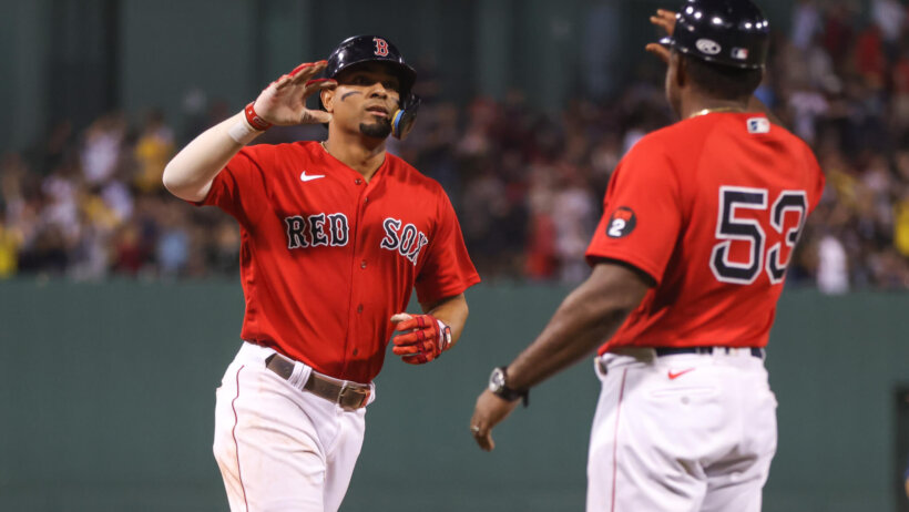 Xander Bogaerts about to high-five teammate