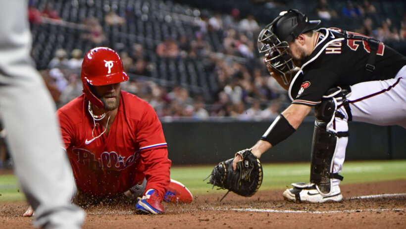 Bryce Harper slides home safely
