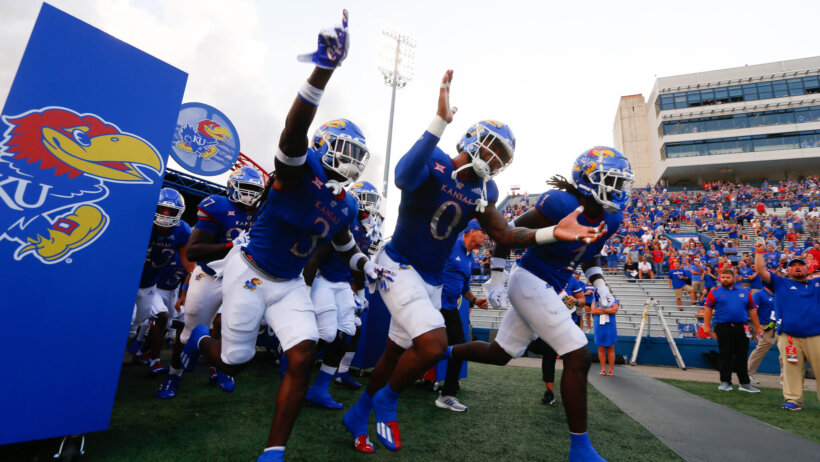 Kansas Jayhawks players running out of the tunnel