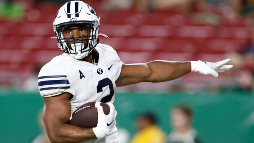 BYU running back Christopher Brooks reacts after running the ball in for a touchdown