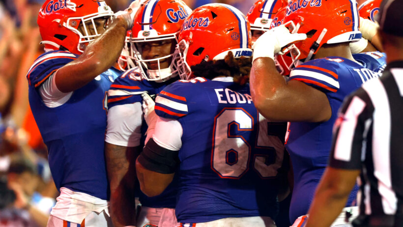 Florida Gators quarterback Anthony Richardson is congratulated by teammates after scoring touchdown