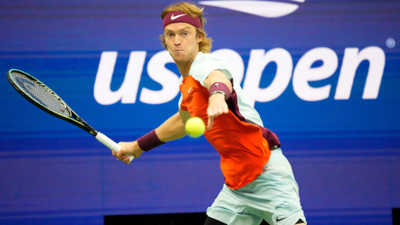 Andrey Rublev hitting a forehand shot during a tennis match.