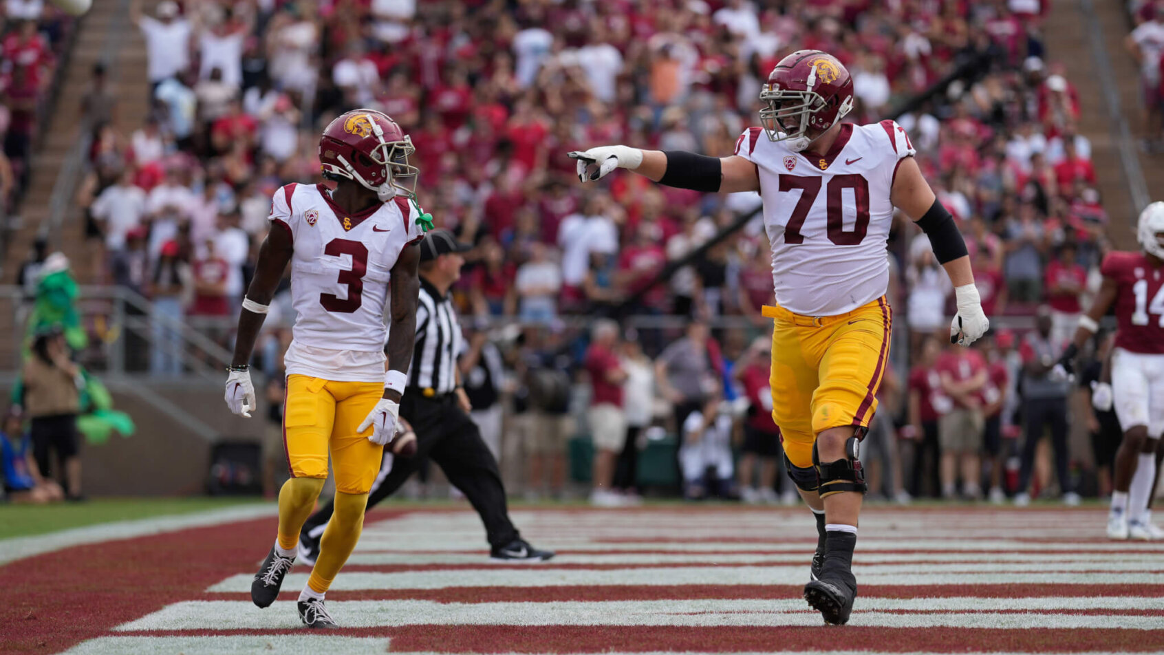 USC offensive lineman Bobby Haskins points at wide receiver Jordan Addison after scoring a touchdown