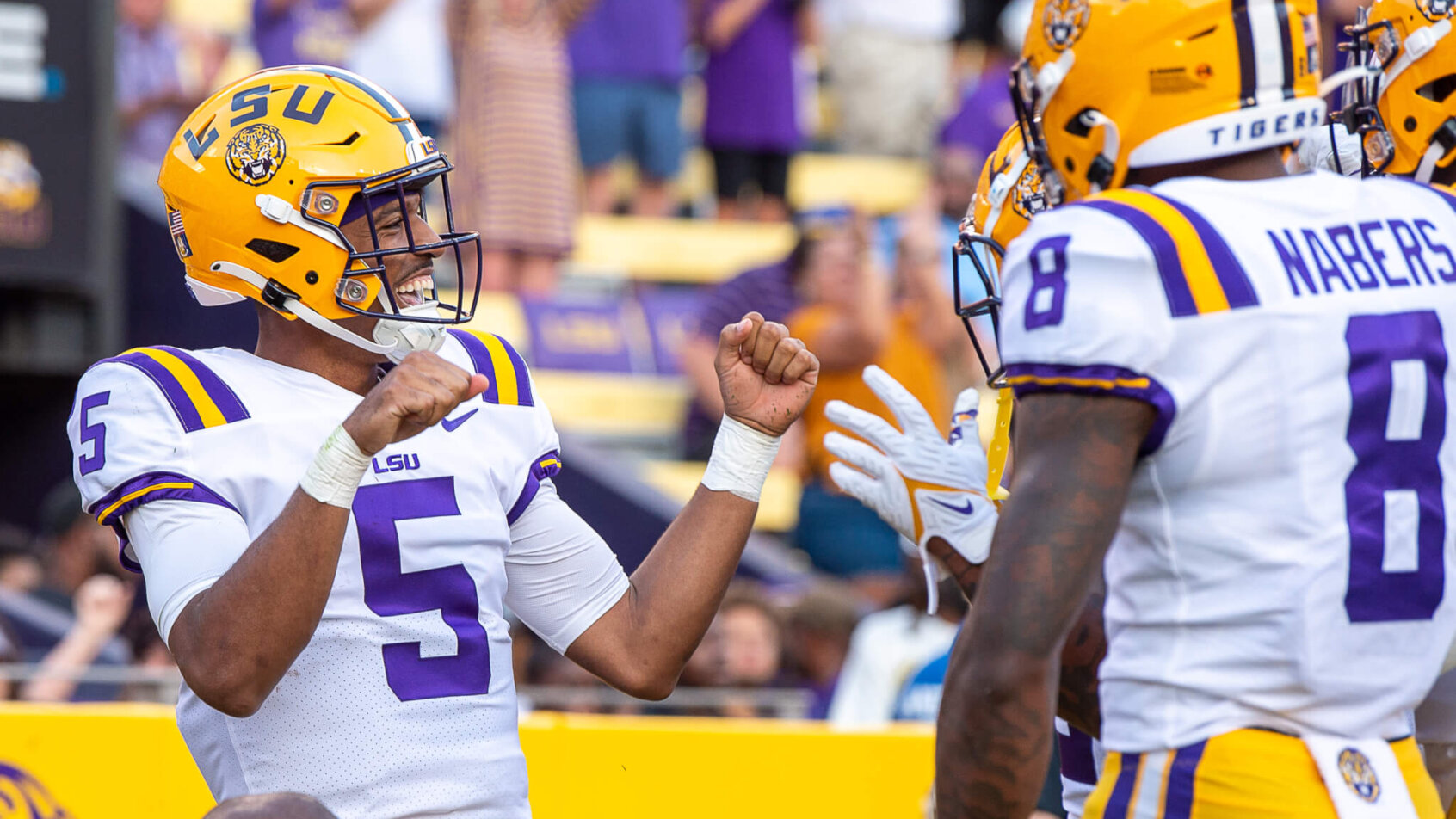 LSU Tigers quarterback Jayden Daniels celebrates after scoring a touchdown