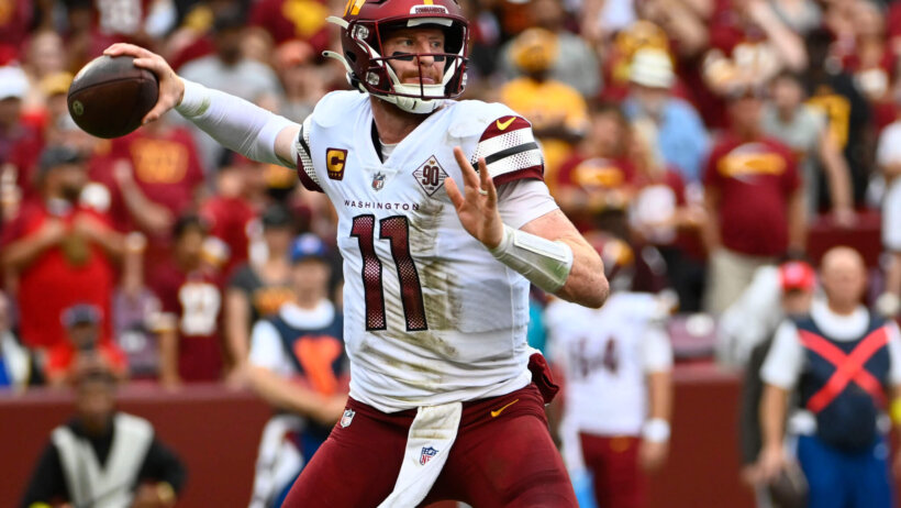 Washington Commanders quarterback Carson Wentz attempts a throw