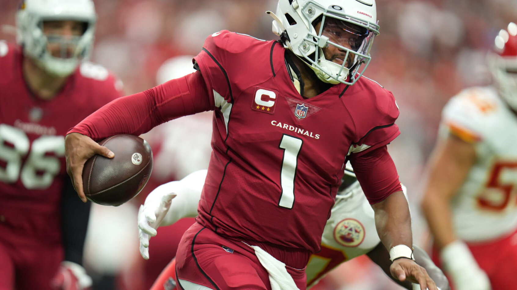 Arizona Cardinals quarterback Kyler Murray scrambles with the ball