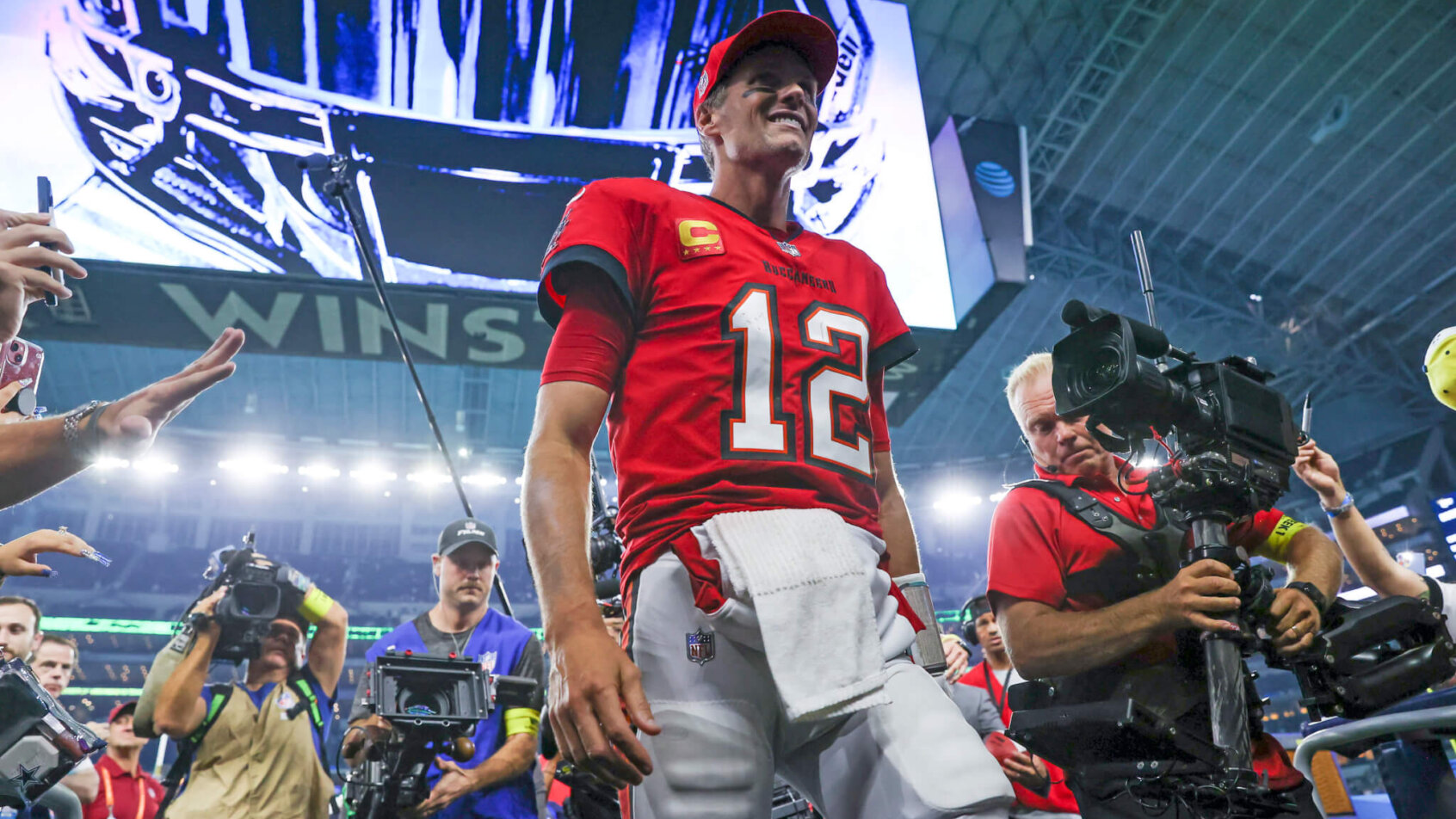 Tom Brady walking off after a win over the Cowboys