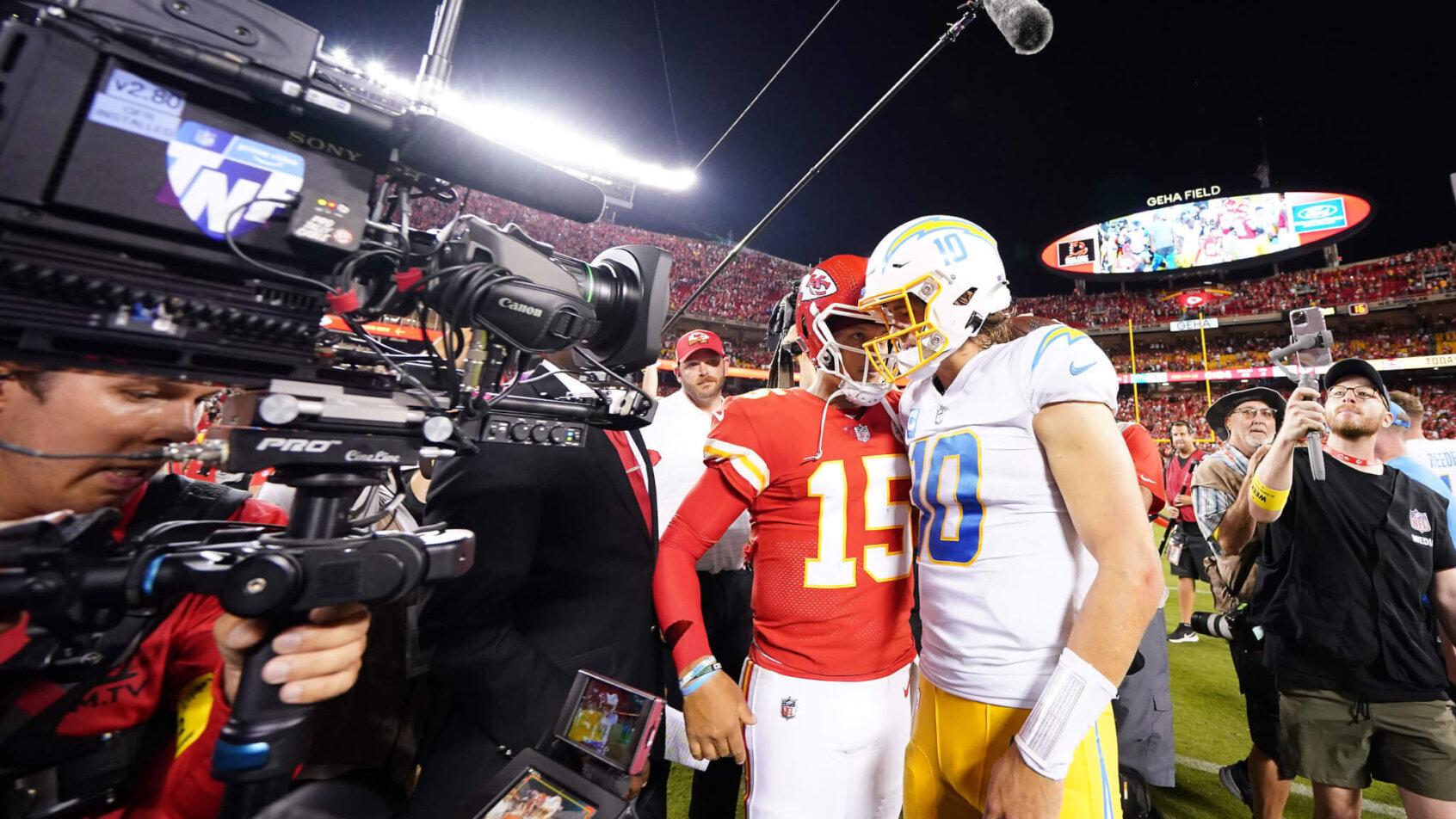 Justin Herbert and Patrick Mahomes embrace