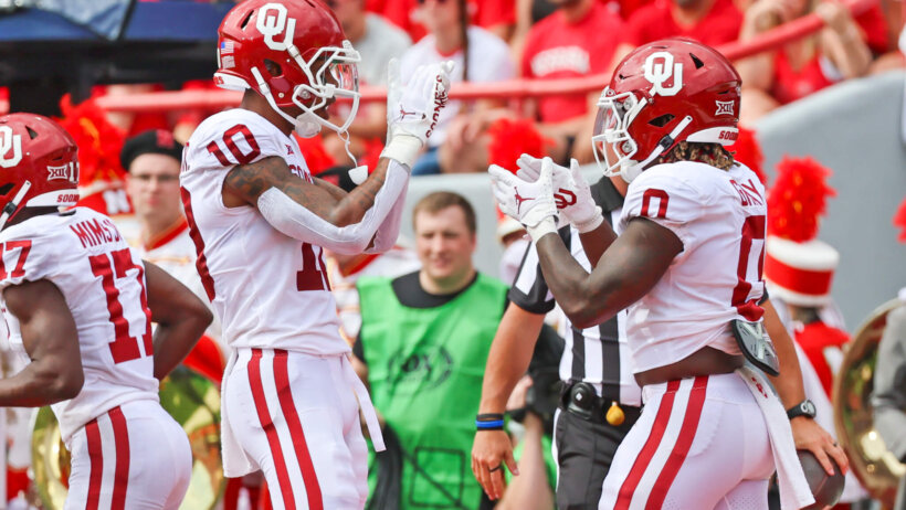 Oklahoma Sooners running back Eric Gray celebrates with wide receiver Theo Wease
