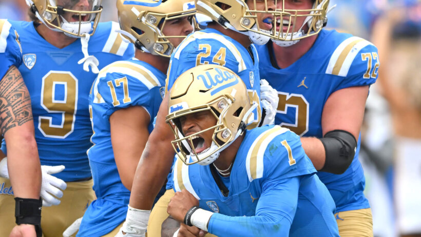 UCLA Bruins quarterback Dorian Thompson-Robinson celebrates with running back Zach Charbonnet