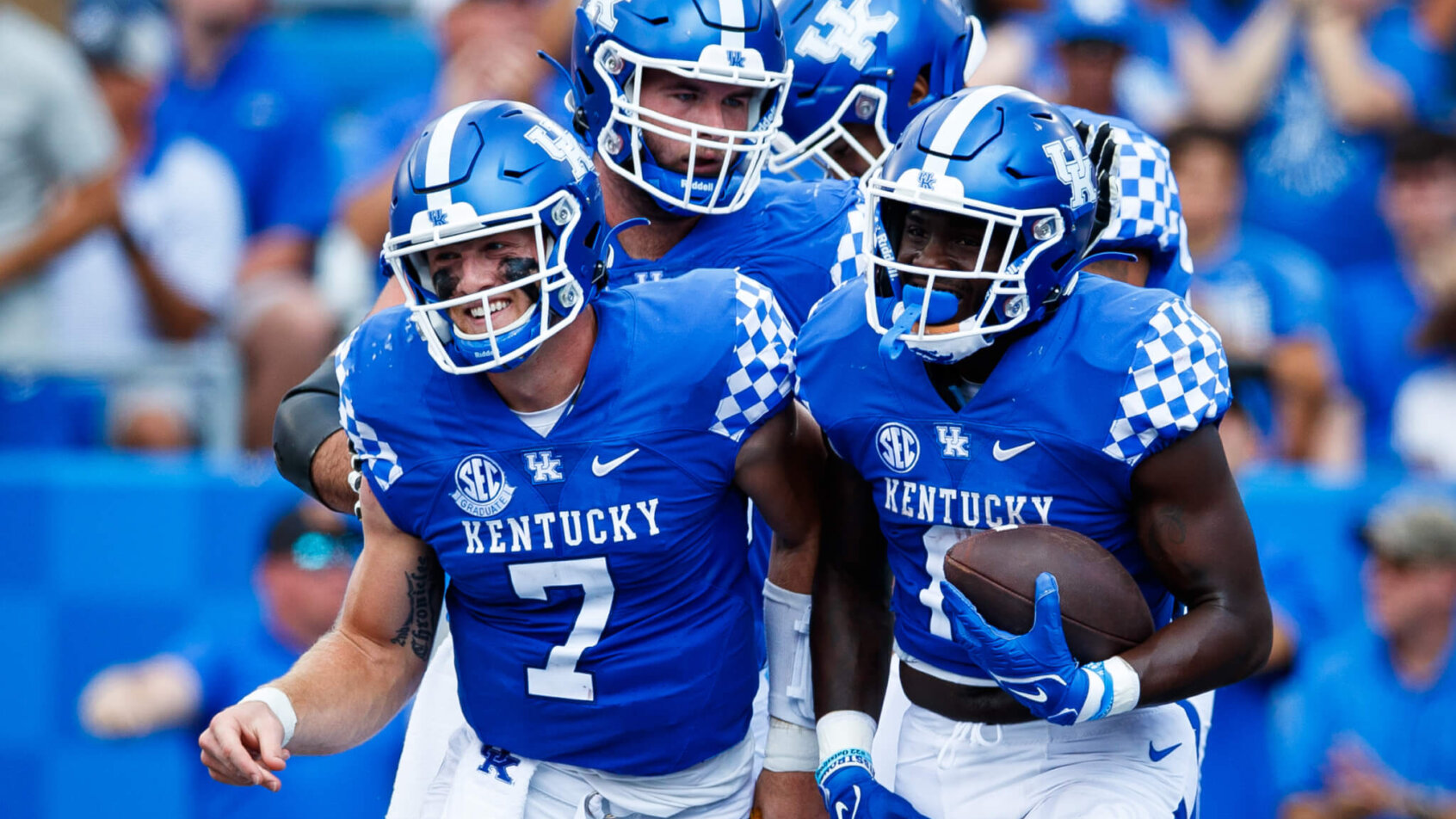 Kentucky Wildcats quarterback Will Levis celebrates with running back Kavosiey Smoke