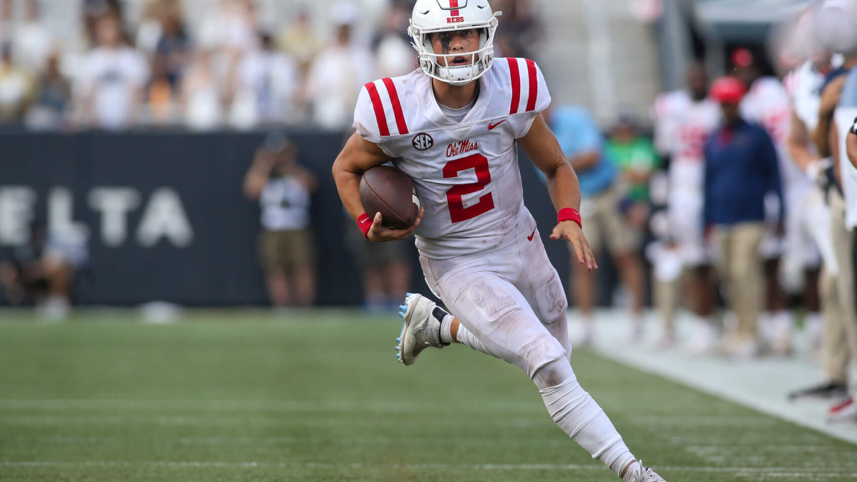 Mississippi Rebels quarterback Jaxson Dart scrambles