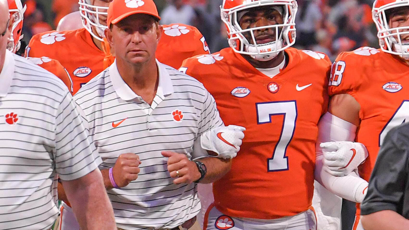 Dabo Swinney leads Clemson onto the field
