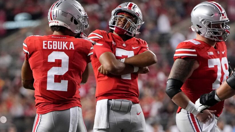 Ohio State Buckeyes quarterback C.J. Stroud celebrates a touchdown with wide receiver Emeka Egbuka